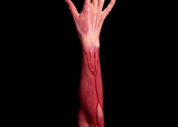 persons left hand with pink paint