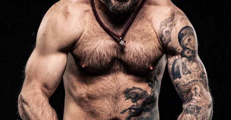 Shouting Shirtless Bodybuilder with Tattoos