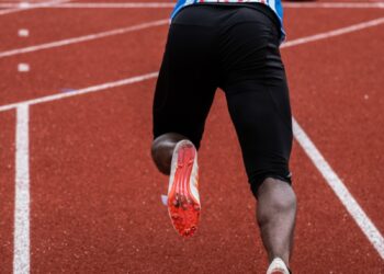 athletic's on starting line during daytime