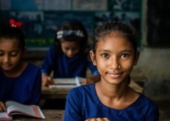 a few young girls in a classroom