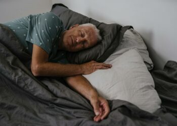An Elderly Man Sleeping on the Bed
