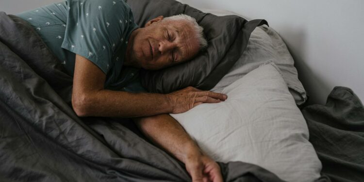 An Elderly Man Sleeping on the Bed