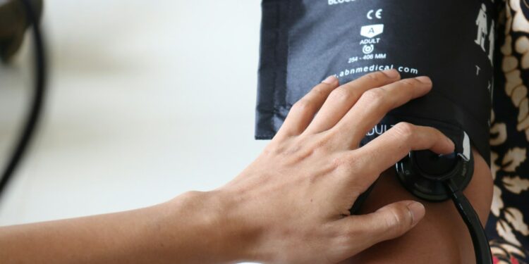 person holding black dslr camera