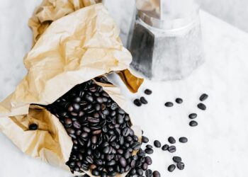 black coffee beans and gray mocha pot