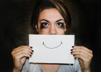 person holding white printer paper