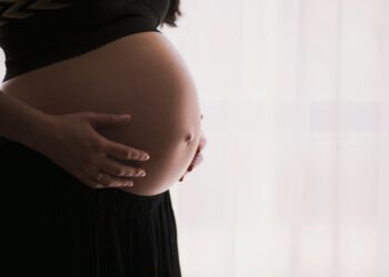 woman holding stomach