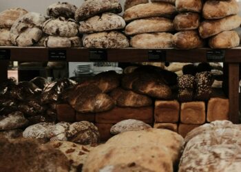baked breads on brown wooden rack