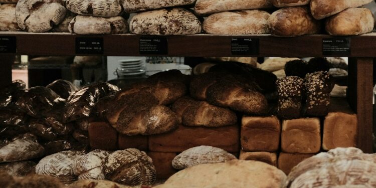 baked breads on brown wooden rack