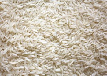 a pile of white rice sitting on top of a table