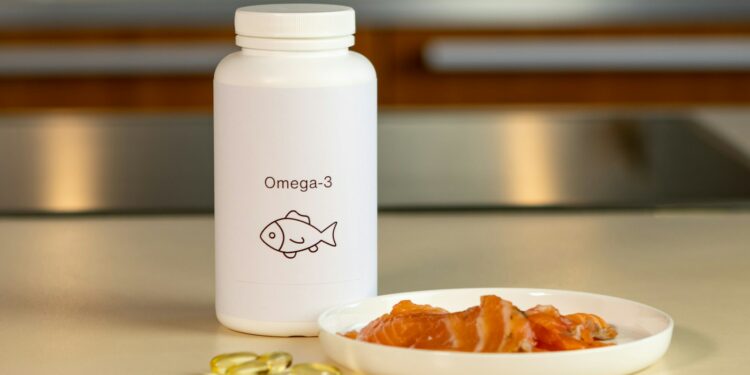 a bowl of fish next to a bottle of vitamins