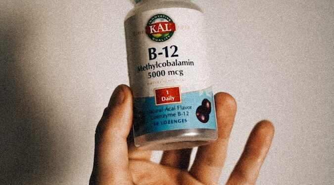 a person holding a bottle of vitamins in their hand