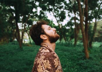 man standing near tree