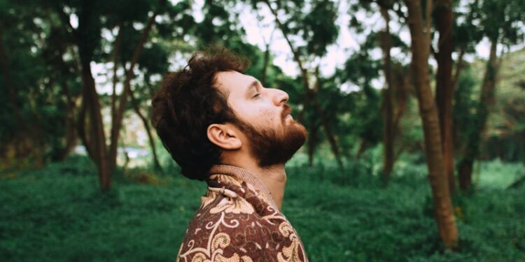 man standing near tree