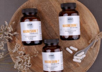 three bottles of magnesum on a wooden plate