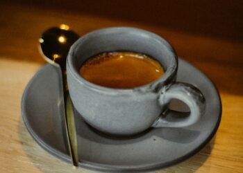 a cup of coffee sitting on top of a saucer