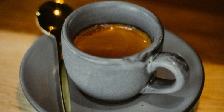 a cup of coffee sitting on top of a saucer