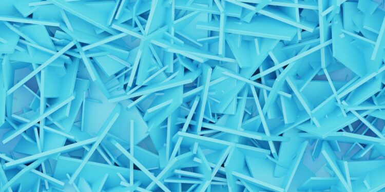 a large pile of blue plastic shards