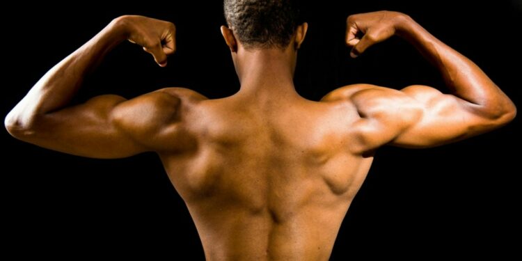 topless man with black background