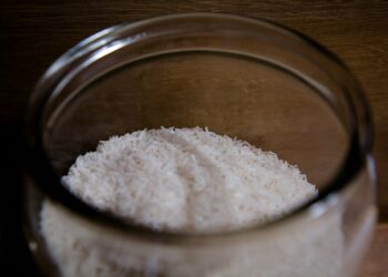 white powder in clear glass container