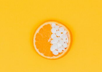 orange fruit slices on yellow surface