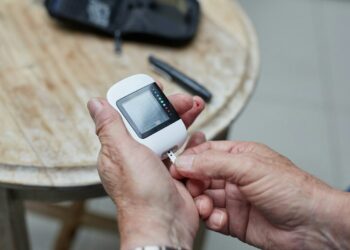 a person testing blood sugar