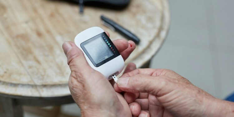 a person testing blood sugar