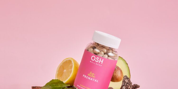 A jar of vitamins sitting on top of a pile of rocks