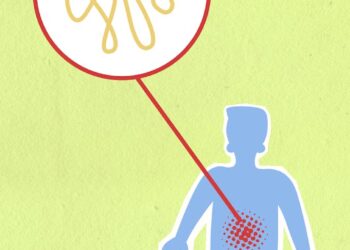 Cardboard illustration of sick human figure with genetic material in organism on green background