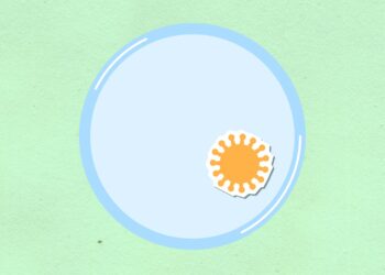 Top view of cutout paper composition of virus on round shaped cell on green background